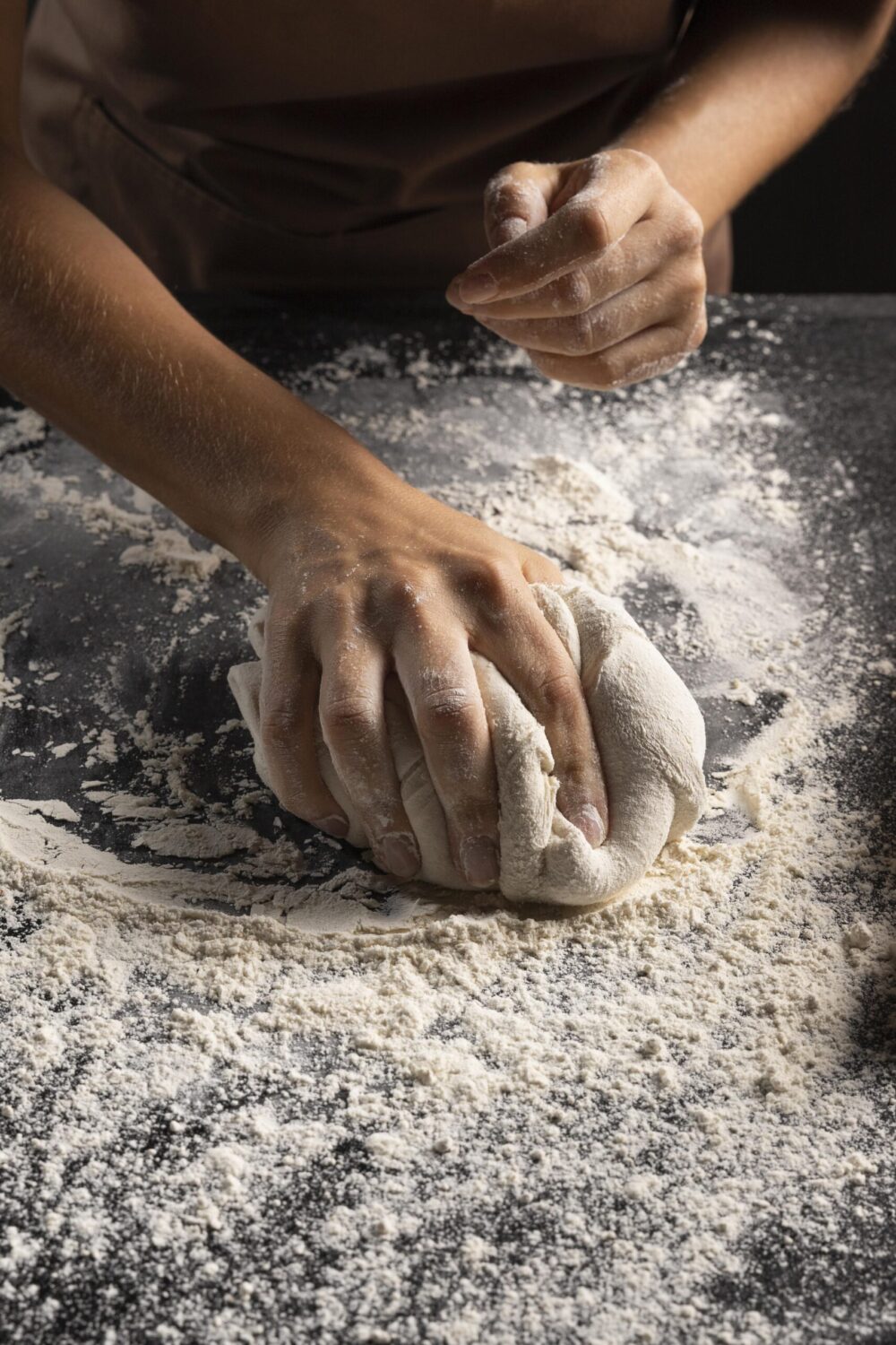 chef-covering-dough-flour-make-it-less-sticky